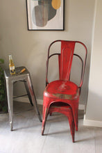 Load image into Gallery viewer, Pair of red aluminium industrial chairs stacked from  josriches.co.uk
